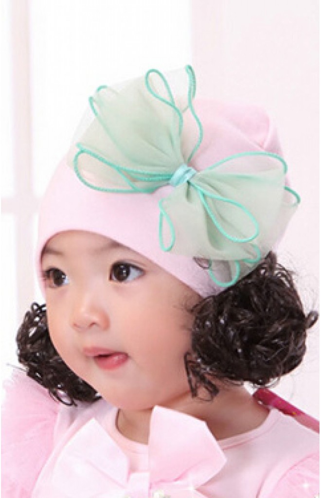 หมวกปอยผมสีชมพูอ่อนแต่งโบว์ใหญ่สีเขียว หมวกปอยผมสีชมพูอ่อนแต่งโบว์ใหญ่สีเขียว