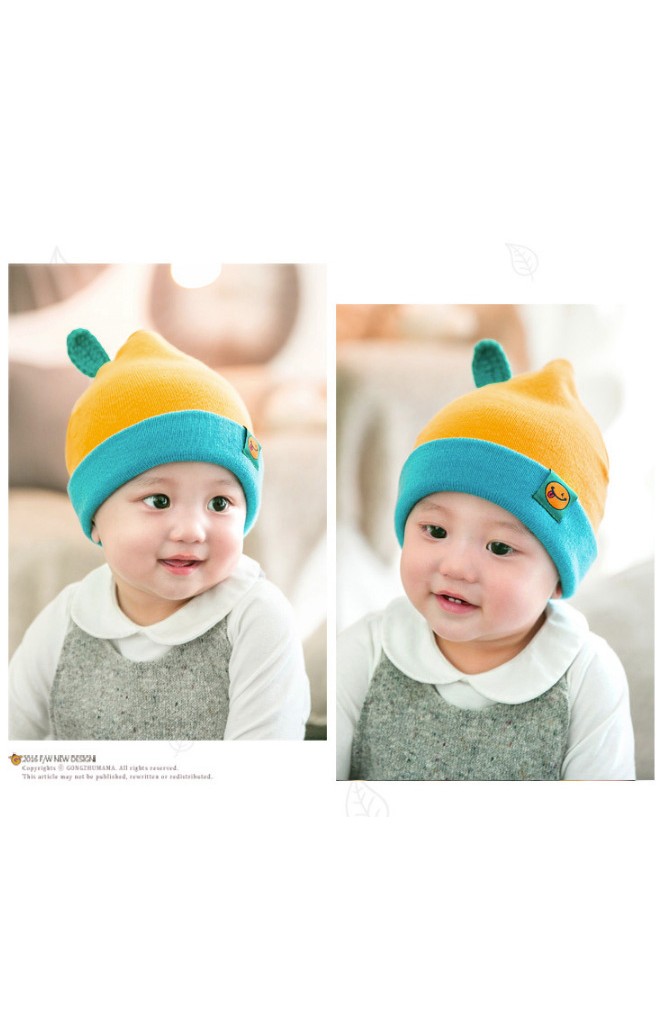 หมวกบีนนี่ยอดแหลมพับขอบแต่งป้ายผลส้มและใบ จาก GZMM