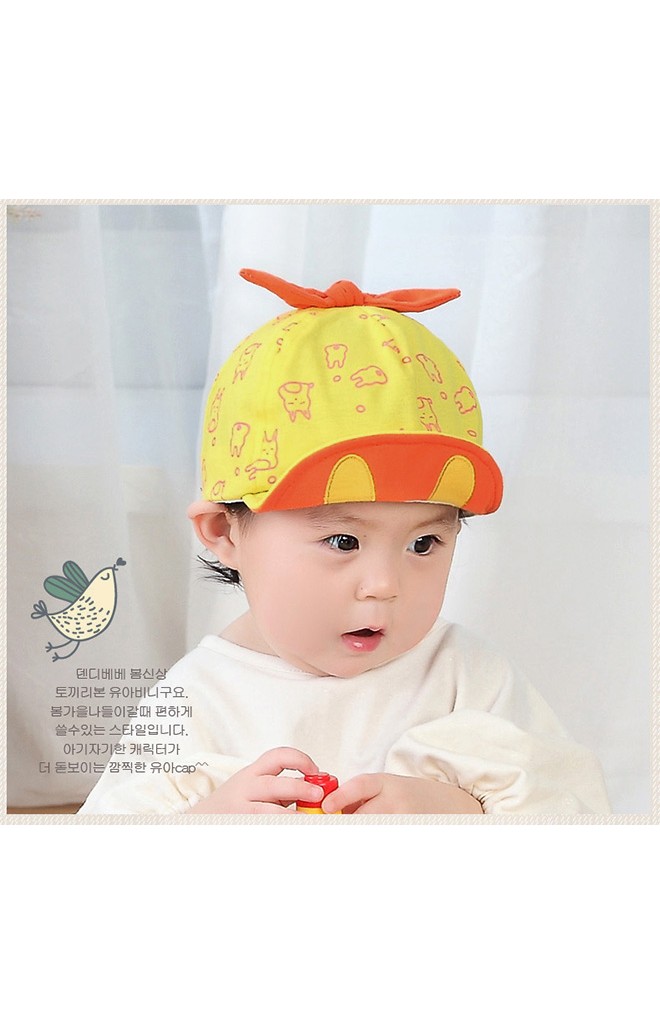 หมวกแก๊ปลายกระต่ายด้านบนแต่งโบว์ผูก จาก TIANYI BEAR
