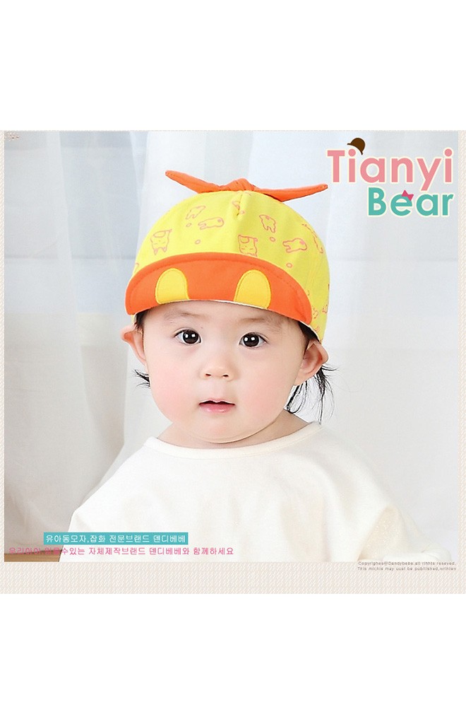 หมวกแก๊ปลายกระต่ายด้านบนแต่งโบว์ผูก จาก TIANYI BEAR