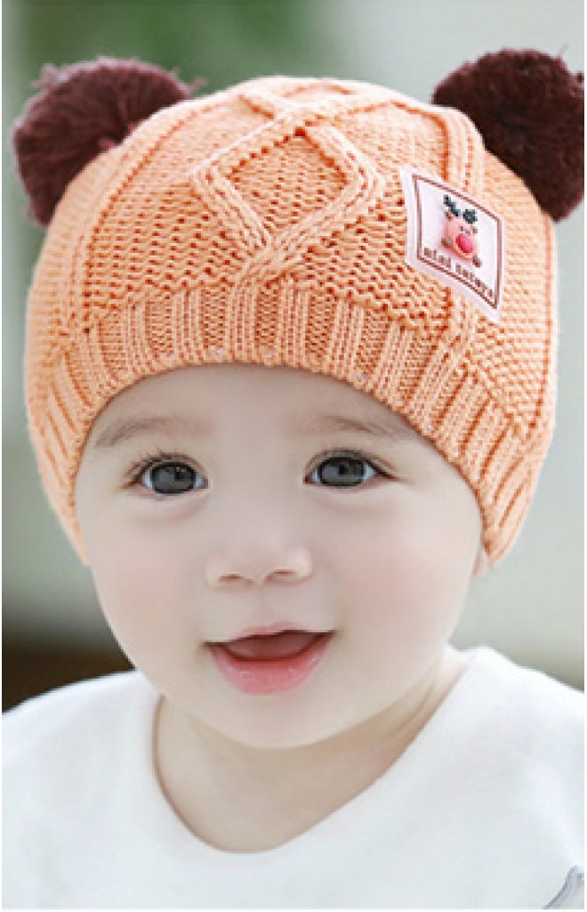หมวกไหมพรมสีส้มแต่งหูปอมด้านบน ด้านหน้าแต่งรูปกวาง TUTUYA หมวกไหมพรมสีส้มแต่งหูปอมด้านบน ด้านหน้าแต่งรูปกวาง TUTUYA
