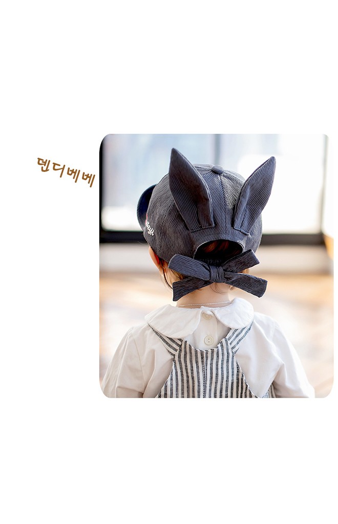 หมวกแก๊ปด้านแต่งหูกระต่าย ด้านหลังเป็นยางยืดและมีโบว์ผูก KUKUJI