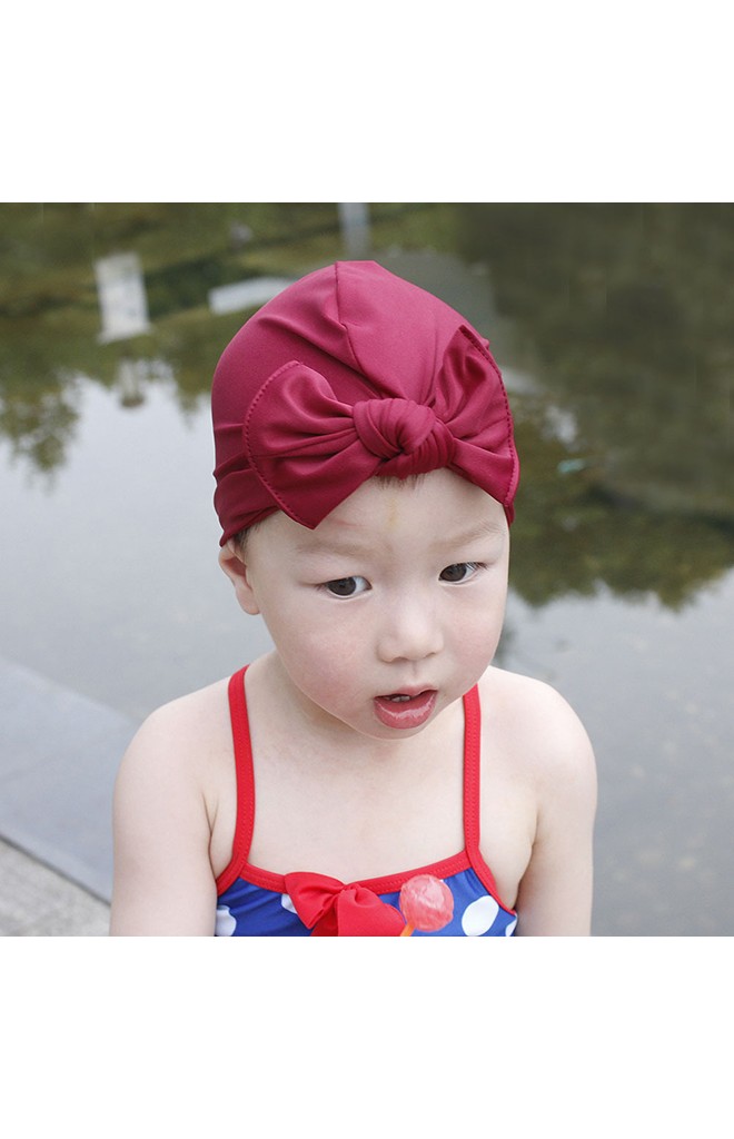 หมวกว่ายน้ำเด็กหญิงแบบสีพื้นผูกโบว์น่ารัก